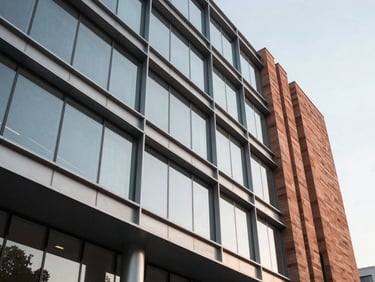 Modern commercial office building facade on G.S. Road, featuring clean steel lines, glass panels, and terracotta architectural details.