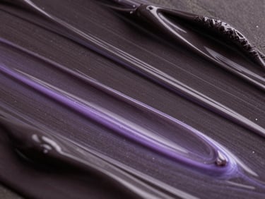 Abstract digital fluid dynamics in deep charcoal and glowing lavender, simulating high-end beauty product textures, macro shot
