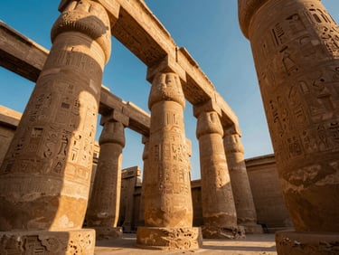 Low angle shot of colossal sandstone pillars at Karnak Temple, harsh desert sun casting long dramatic shadows across hieroglyphic carvings, warm terracotta tones.