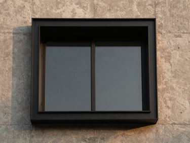 Geometric architectural crop of matte black steel frames meeting glass, deep shadows, minimal composition.
