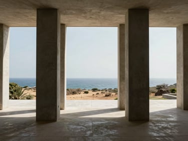 Inside a spacious villa interior looking out to a dry coastal landscape, massive concrete columns framing the horizon, bright natural light.