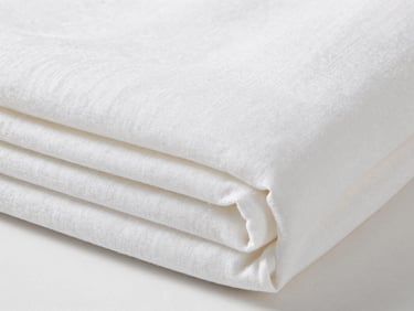Close-up of soft linen white bamboo fiber bedding folded neatly, bright neutral studio light, detailed textile textures