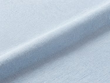 Macro photography of ice-blue cooling fabric texture, showing fine weave structure, bright clean studio lighting, high-tech textile aesthetic