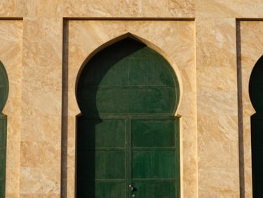 Architectural detail of Madinah stone facade, warm golden hour light, clean geometric lines, 35mm editorial