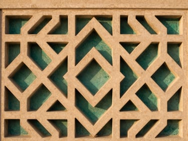Close-up of elegant geometric stone carvings in warm sand tones, soft shadows, architectural symmetry, minimalist Islamic design