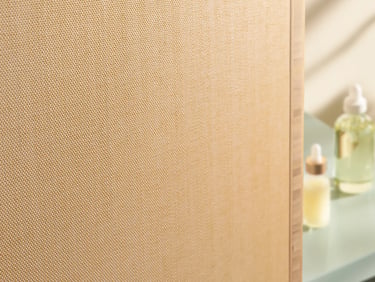 Neutral fabric wall finish with discreet track edge detail