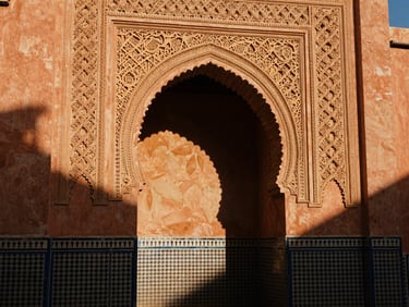 Intricate Islamic mosaic archway in Morocco, warm sunlight casting long shadows, rich terracotta and gold textures