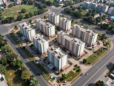 Aerial photograph of a large residential project site in Mohali sector 109, marked boundary lines visible from above, surrounding green belt and wide arterial road in frame, shot in natural daylight with long shadows
