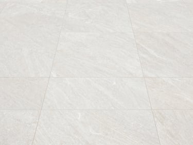 Overhead flat-lay of a pristine, freshly cleaned patio with large format tiles, bright overcast daylight, clean stone textures, crisp architectural photography, sharp details