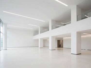 Wide architectural shot of a spotless modern office space, crisp interior lighting, premium finish, 35mm lens
