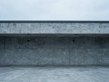 Minimalist architectural photography of a concrete loading dock, cool overcast daylight, desaturated blue tones, sharp focus