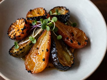 Extreme close-up overhead of a handcrafted restaurant dish — roasted vegetables, microgreens, ceramic plate — in north-facing daylight, textures sharp and unfussy