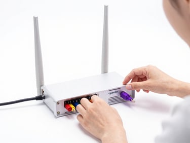 Hands of a female engineer adjusting cables on an OpenVox wireless gateway, bright high-key studio lighting, clean white backdrop