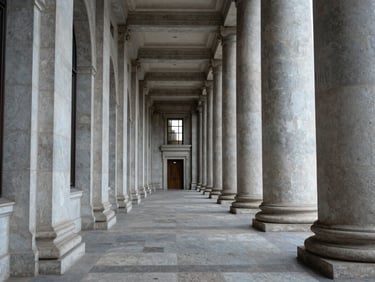 Architectural detail of a courthouse corridor, symmetrical stone columns receding into the distance, cool natural light from high windows, empty hallway, no people