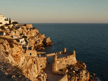 Cinematic wide-angle shot of Cartagena coastal cliffs near Mar Menor, ancient military batteries overlooking the deep blue sea, golden hour.