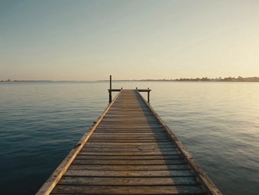 Cinematic shot of a wooden pier stretching into the calm Mar Menor lagoon in Santiago de la Ribera, soft dawn light.
