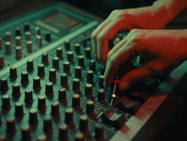 Close-up of hands adjusting dials on a vintage audio mixing console, moody green neon lighting