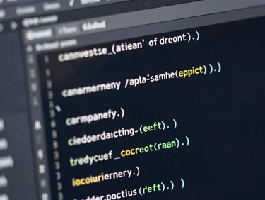 Extreme macro close-up of clean code blocks in a dark-mode editor, cool silver highlights reflecting off a glass screen, deep navy shadows, sharp focus.