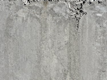 Macro texture of structural concrete cancer remediation, exposed steel reinforcement rebar, high-contrast concrete textures, cool grey tones.