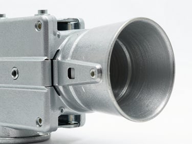 Close-up of a heavy-duty single flap smoke vent actuator and hinge mechanism, crisp studio lighting, metallic textures, 35mm