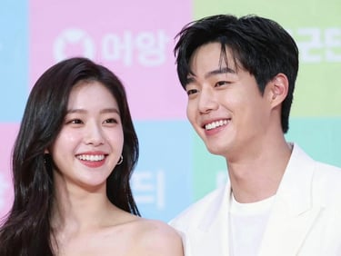 Expressive close-up of a handsome Korean actor and elegant actress laughing together at a press conference, vibrant editorial lighting