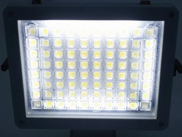 Slim LED panel light, uniform illumination, cool high-key laboratory light, sharp metallic textures