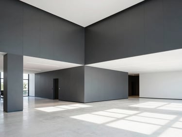 Wide architectural interior of a modern sunlit office lobby with freshly painted clean charcoal accent walls, crisp lines, professional finish, 35mm