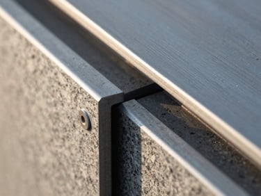 Extreme macro detail of architectural structural materials, steel and granite interfaces under crisp morning light, clean lines, high contrast.