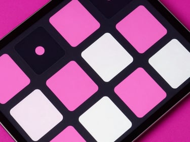 Top-down flat lay of high-fidelity social media grid layouts on a dark tablet screen, neon pink accents, sharp focus
