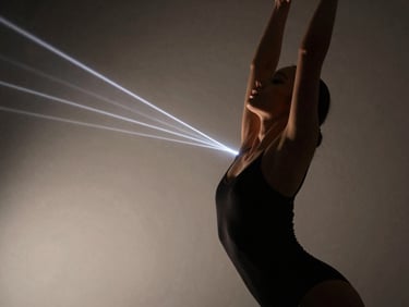 Close-up of physical form in motion, laser light beams cutting through haze, dramatic high-contrast studio lighting, elegant contemporary dance, 35mm