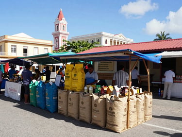 A colorful outdoor market stall displaying bags of local Yauco coffee under bright Caribbean sun.