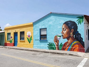 Wide shot of the colorful Yaucromatic street art murals in Yauco, bright natural Caribbean daylight, vibrant paint colors