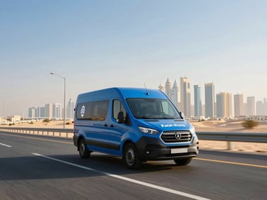 Dynamic wide-angle shot of a Falcon Route delivery van driving on a clean UAE highway during golden hour, modern Dubai skyline blurred in the background.
