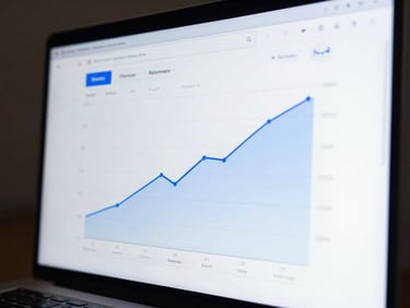Analytical dashboard showing upward-trending retention graphs, clean UI, low-key cool blue rim lighting, high-contrast display.