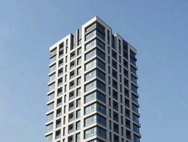Sharp architectural angle of a modern high-rise building facade against a blue sky, clean minimalist composition, premium real estate aesthetic, 35mm