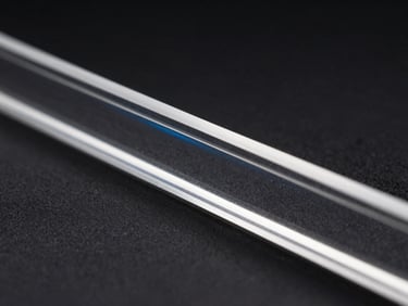 Extreme close-up of a laser-cut acrylic edge, perfectly clear and smooth, with a subtle blue laser beam reflection, high-contrast dark studio lighting.