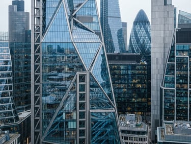 High-angle architectural crop of London financial district, sharp glass reflections, cool overcast daylight, 35mm
