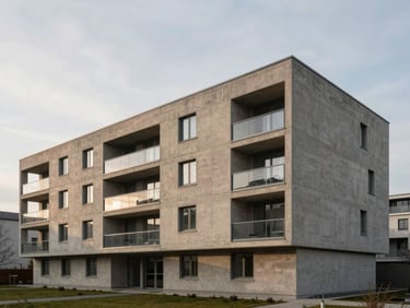 Wide architectural elevation of a modernist concrete residential building in Munich, soft overcast morning light, sand and graphite tones, Hasselblad medium format
