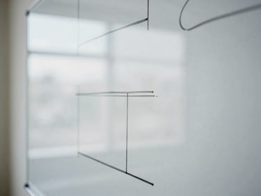 Close-up of a structured whiteboard with clean hand-drawn diagrams, soft natural window light, desaturated cool tones, 35mm