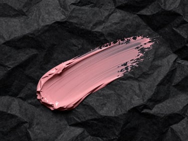Extreme close-up of crumpled black paper texture slashed with a single dusty rose paint stroke, harsh flash, deep shadows, brutalist fine-art composition