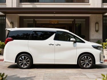 Pristine white Toyota Alphard parked in a luxury hotel driveway, side profile, bright daylight, professional 35mm.