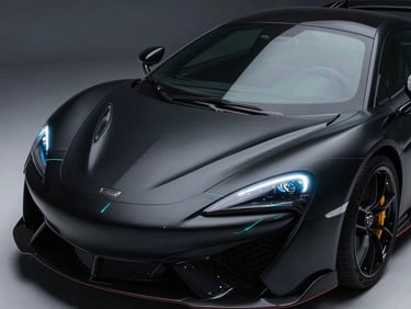 Sleek matte-black supercar under high-contrast studio spotlights, sharp teal laser lines scanning the hood, clean reflections, 35mm