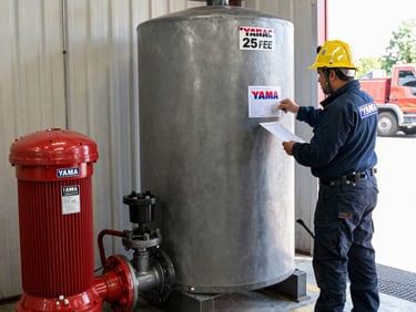 Industrial centrifugal water pumps with electric motors and pressure gauges on a metal frame.