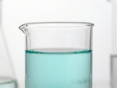 Bright high-key macro close-up of sterile laboratory glassware with precise teal liquid, clean white clinical studio light, sharp focus.