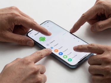 Macro crop of diverse hands interacting with a clean, high-contrast Android user interface on a modern smartphone, sharp cyber-mint details, cool studio lighting