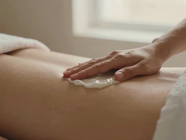 Close-up of a luxurious hand massage with rich cream, soft focus, warm champagne lighting, serene atmosphere.