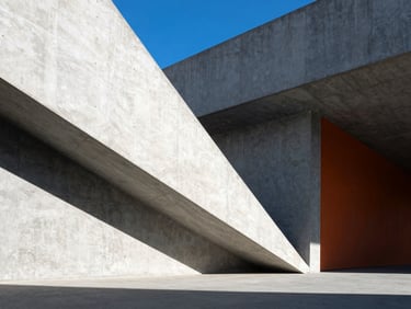 High-contrast architectural photography of sharp concrete angles under direct sunlight, deep geometric shadows, electric blue accents, 35mm wide-angle