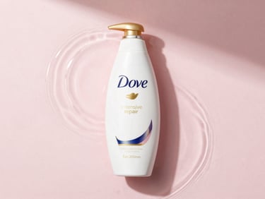Elegant top-down flat lay of Dove intensive repair shampoo bottle, soft water ripples, delicate pink background, natural window light, 35mm