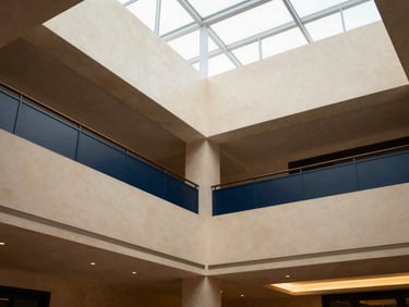 Interior of The Enclave Clubhouse, modern design, high ceilings, natural daylight, warm editorial photography, muted champagne and navy tones, architectural lens.