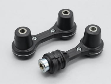 Studio shot of an automotive stabilizer link, clean light gray background, sharp focus on rubber boots and metal studs.